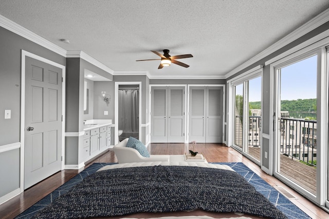 6331 Saint Croix Trl N, Stillwater, MN 55082 - bedroom with access to exterior, wood finished floors, ornamental molding, a textured ceiling, and a sink
