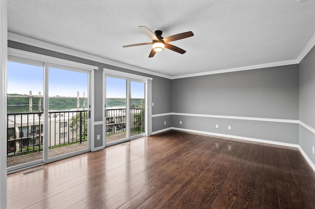 6331 Saint Croix Trl N, Stillwater, MN 55082 - unfurnished room with a ceiling fan, a water view, wood finished floors, a textured ceiling, and crown molding