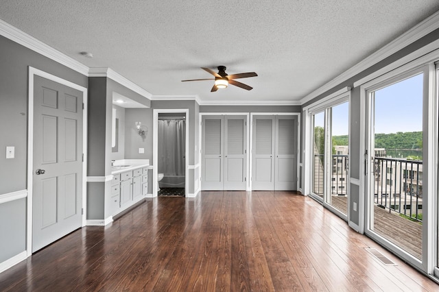 6331 Saint Croix Trl N, Stillwater, MN 55082 - unfurnished bedroom with access to outside, a textured ceiling, wood-type flooring, crown molding, and ceiling fan
