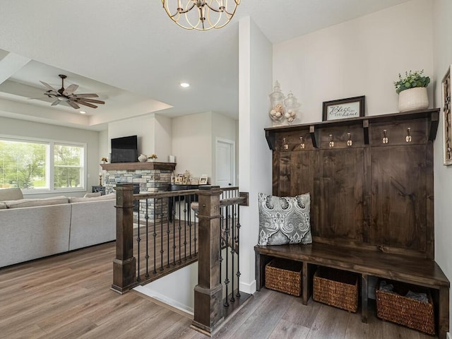 3309 171st Ave NE, Ham Lake, MN 55304 - mudroom with wood finished floors, a ceiling fan, a chandelier, recessed lighting, and a fireplace