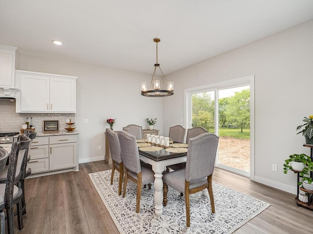 3309 171st Ave NE, Ham Lake, MN 55304 - dining space with a chandelier, dark wood finished floors, and recessed lighting