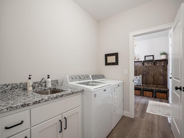 3309 171st Ave NE, Ham Lake, MN 55304 - laundry area featuring separate washer and dryer, dark wood-type flooring, and cabinet space
