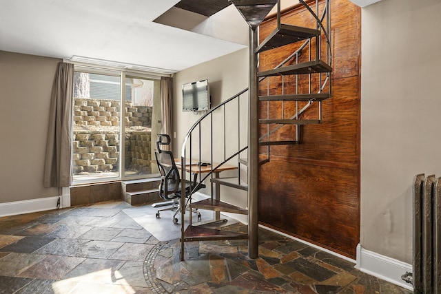 112 Western Ave N Unit 4, Saint Paul, MN 55102 - stairs with baseboards, radiator heating unit, and stone tile flooring