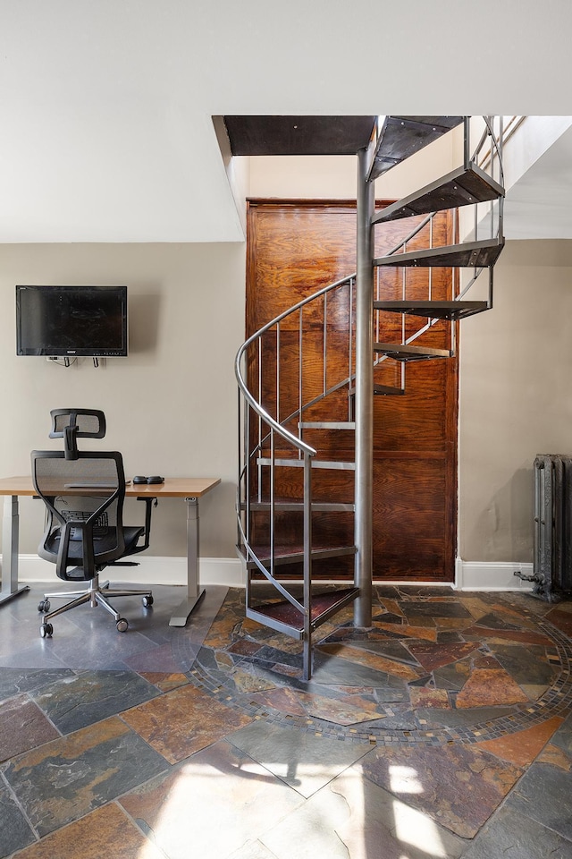 112 Western Ave N Unit 4, Saint Paul, MN 55102 - stairway with stone tile flooring, baseboards, and radiator heating unit