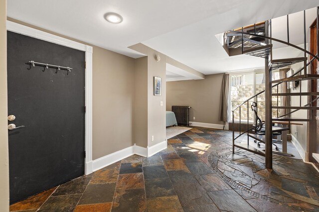 112 Western Ave N Unit 4, Saint Paul, MN 55102 - foyer entrance featuring stone tile floors, stairs, and baseboards