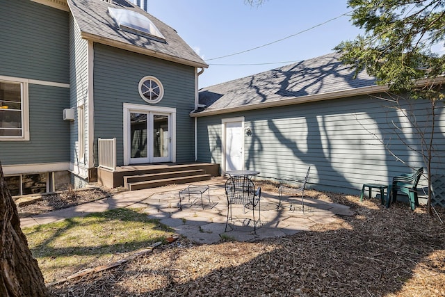 112 Western Ave N Unit 4, Saint Paul, MN 55102 - rear view of house featuring a patio, a shingled roof, and french doors
