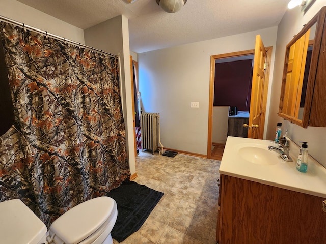 315 3rd St SW, Stewartville, MN 55976 - bathroom with radiator, vanity, toilet, and curtained shower