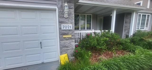 7021 Penn Ave S, Richfield, MN 55423 - garage featuring covered porch