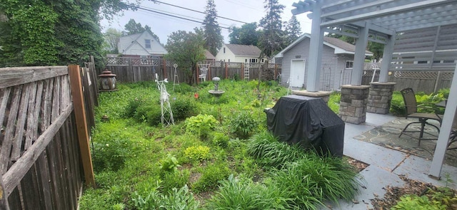 7021 Penn Ave S, Richfield, MN 55423 - fenced backyard featuring a pergola, a patio area, and an outbuilding