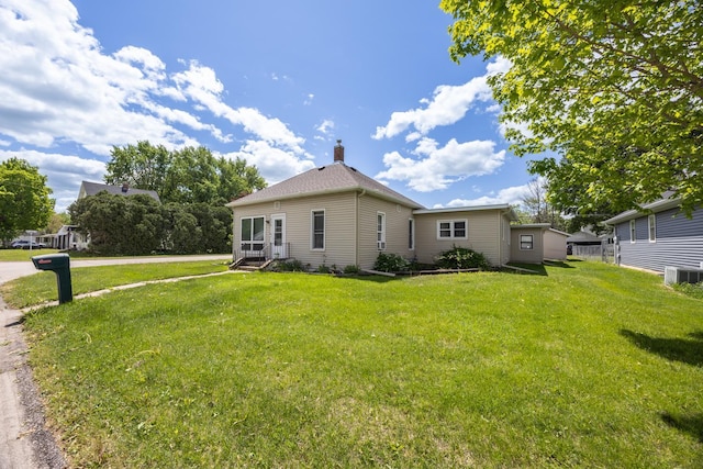 836 Milligan Ave, Wabasha, MN 55981 - view of side of property with central AC, a lawn, and a chimney