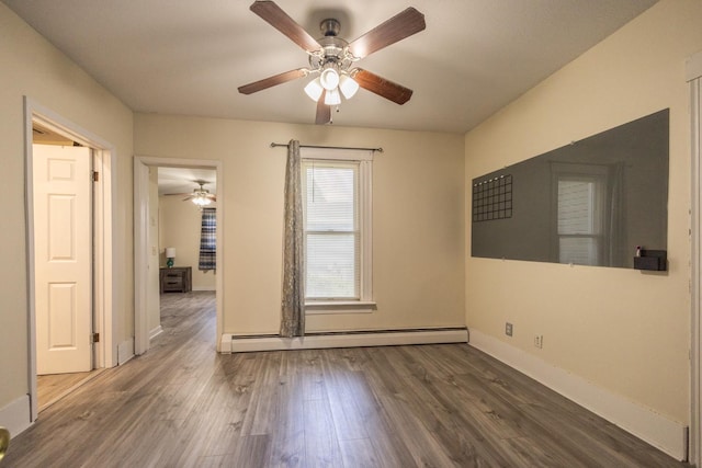 836 Milligan Ave, Wabasha, MN 55981 - unfurnished room with baseboard heating, ceiling fan, wood finished floors, and baseboards