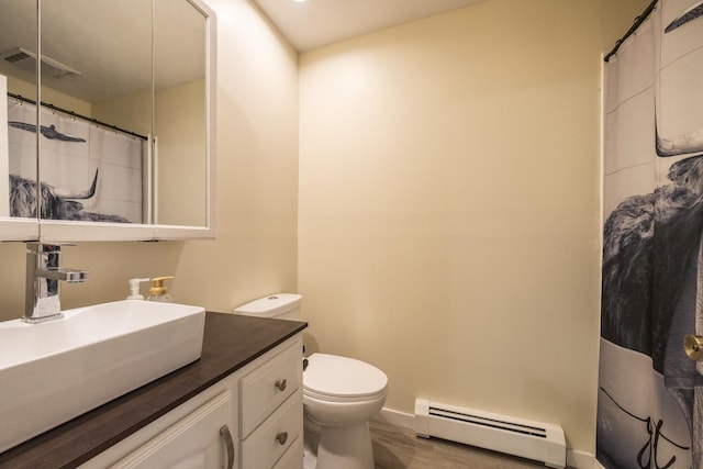 836 Milligan Ave, Wabasha, MN 55981 - bathroom with a baseboard heating unit, vanity, toilet, curtained shower, and baseboards