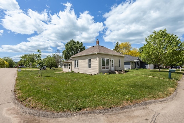 836 Milligan Ave, Wabasha, MN 55981 - view of side of home featuring a yard and a chimney