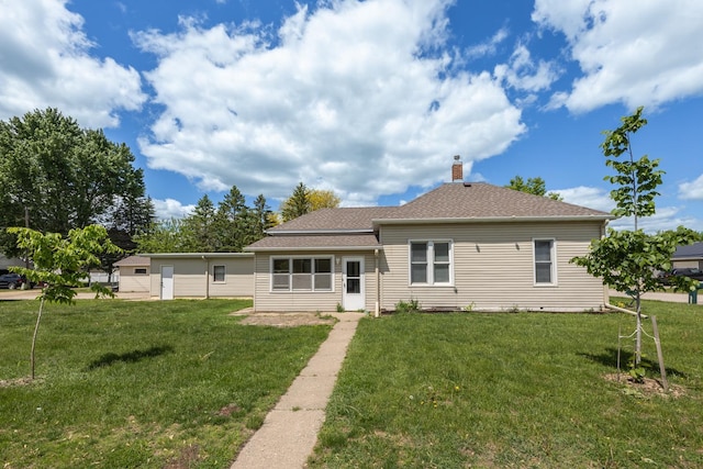 836 Milligan Ave, Wabasha, MN 55981 - back of house featuring a lawn, a chimney, and roof with shingles