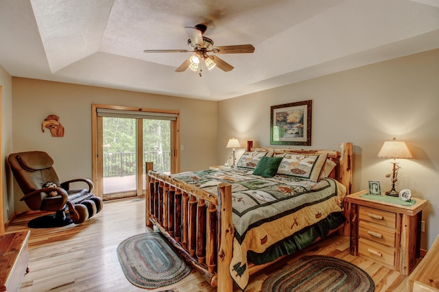 8824 Bittersweet Cir, Breezy Point, MN 56472 - bedroom featuring a raised ceiling, access to outside, light wood-type flooring, a ceiling fan, and baseboards