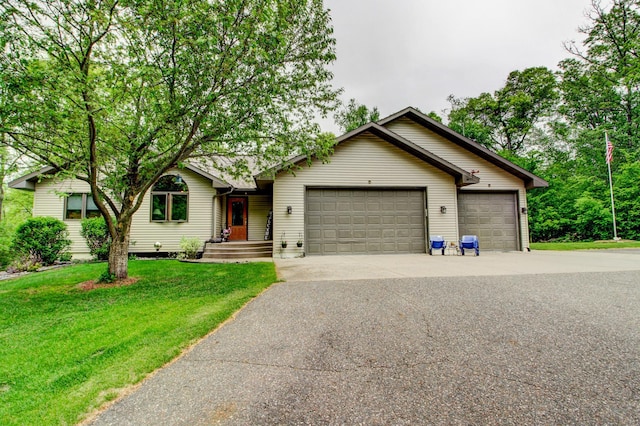 8824 Bittersweet Cir, Breezy Point, MN 56472 - view of front of home featuring an attached garage, concrete driveway, and a front lawn