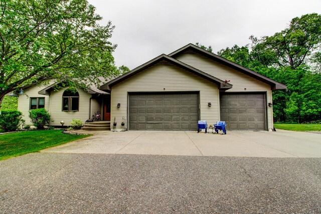 8824 Bittersweet Cir, Breezy Point, MN 56472 - ranch-style home with a garage and concrete driveway