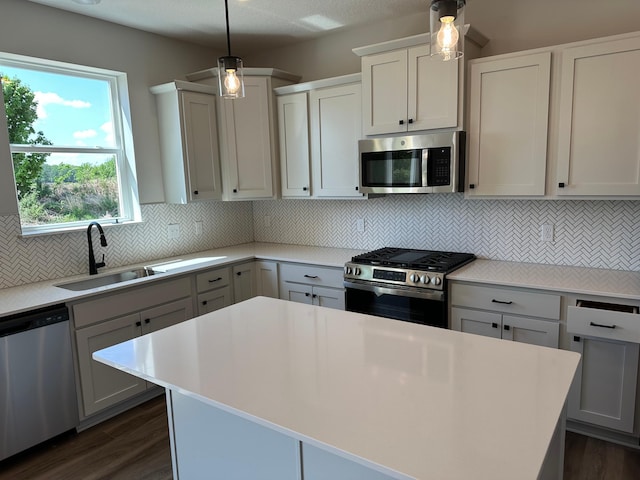 1866 Charleston Ln, Waconia, MN 55387 - kitchen featuring appliances with stainless steel finishes, ceiling fan, light countertops, and decorative backsplash