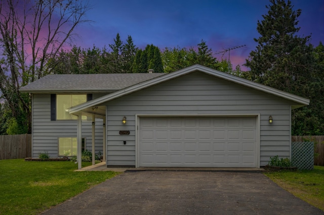 2140 Prospect Dr NE, Saint Cloud, MN 56304 - view of front of property with a garage, asphalt driveway, an outbuilding, and a shingled roof