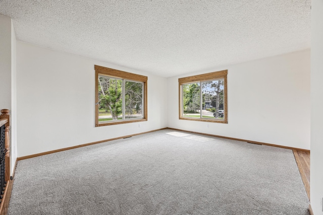2140 Prospect Dr NE, Saint Cloud, MN 56304 - carpeted empty room featuring a textured ceiling and baseboards