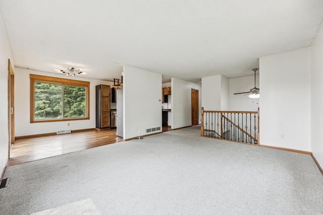 2140 Prospect Dr NE, Saint Cloud, MN 56304 - unfurnished living room with carpet flooring, baseboards, and ceiling fan