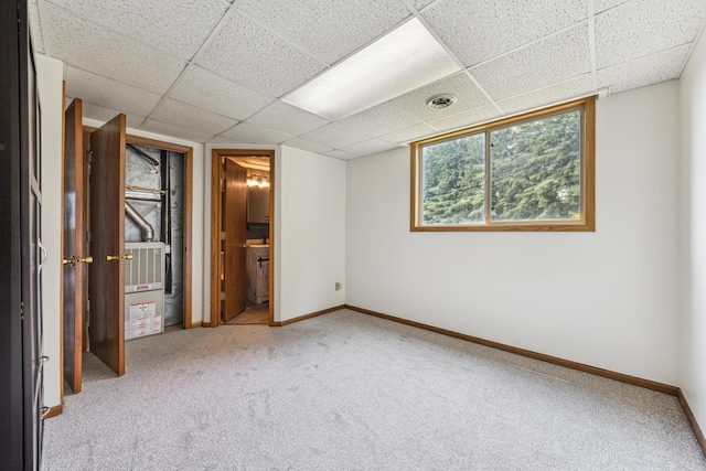 2140 Prospect Dr NE, Saint Cloud, MN 56304 - unfurnished bedroom featuring carpet, baseboards, and a paneled ceiling
