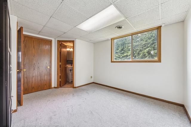 2140 Prospect Dr NE, Saint Cloud, MN 56304 - unfurnished bedroom featuring carpet floors, baseboards, a paneled ceiling, and connected bathroom