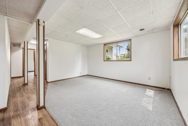 2140 Prospect Dr NE, Saint Cloud, MN 56304 - carpeted empty room with a drop ceiling, baseboards, and wood finished floors