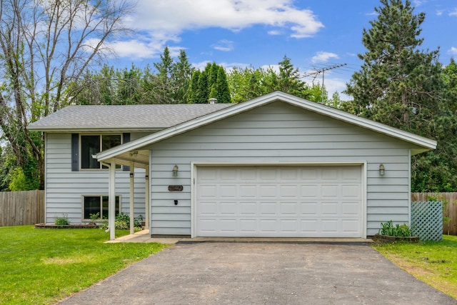 2140 Prospect Dr NE, Saint Cloud, MN 56304 - view of front of house featuring a garage, a shingled roof, and asphalt driveway