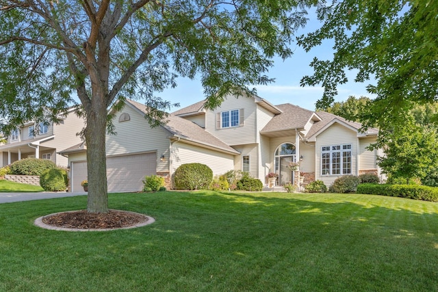 1893 White Oak Dr, Chaska, MN 55318 - traditional home with a shingled roof, a front lawn, a garage, and driveway