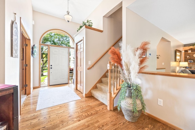 1893 White Oak Dr, Chaska, MN 55318 - foyer with wood finished floors, stairs, and baseboards