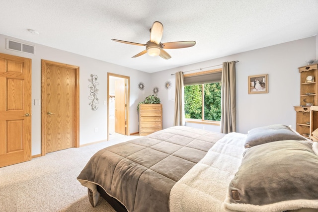1893 White Oak Dr, Chaska, MN 55318 - carpeted bedroom featuring ceiling fan, baseboards, and a textured ceiling