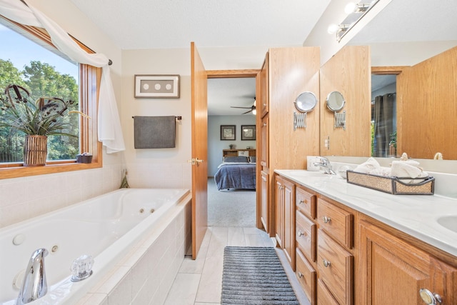 1893 White Oak Dr, Chaska, MN 55318 - ensuite bathroom featuring double vanity, a whirlpool tub, ceiling fan, and tile patterned flooring