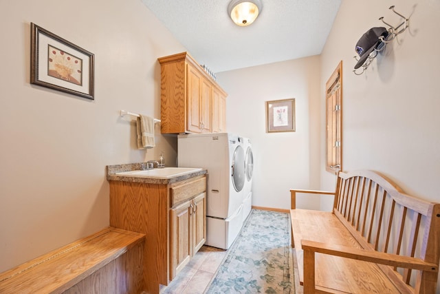 1893 White Oak Dr, Chaska, MN 55318 - laundry area with cabinet space, independent washer and dryer, light tile patterned floors, and baseboards