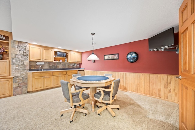 1893 White Oak Dr, Chaska, MN 55318 - dining space featuring wainscoting, light colored carpet, lofted ceiling, and bar