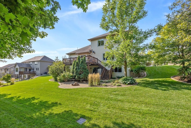 1893 White Oak Dr, Chaska, MN 55318 - view of grassy yard featuring a wooden deck, stairway, and an outdoor fire pit