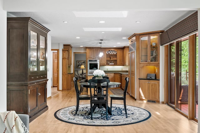 6136 Arctic Way, Edina, MN 55436 - dining space with light wood finished floors, a skylight, and recessed lighting