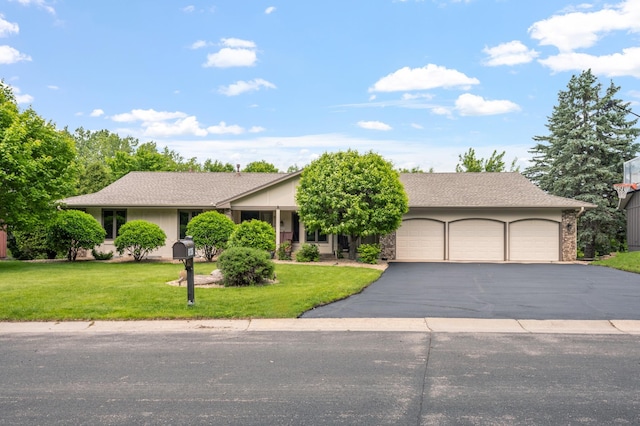 6136 Arctic Way, Edina, MN 55436 - view of front of home featuring a garage, asphalt driveway, and a front yard