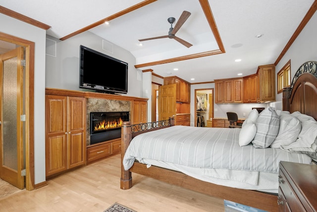 6136 Arctic Way, Edina, MN 55436 - bedroom with light wood-style floors, crown molding, a fireplace, built in study area, and recessed lighting