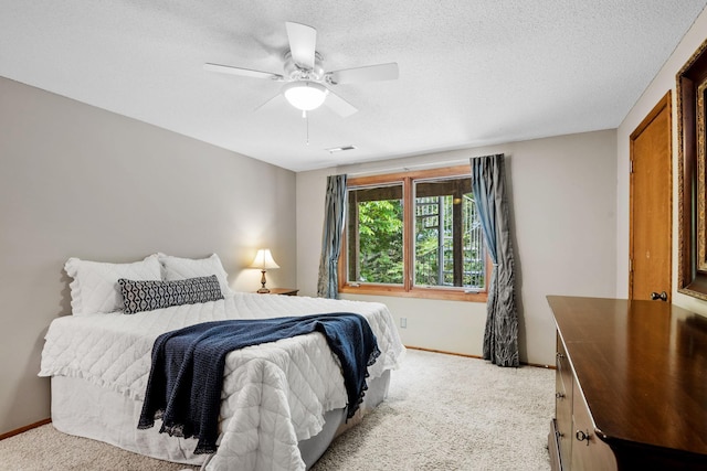 6136 Arctic Way, Edina, MN 55436 - bedroom with light carpet, ceiling fan, and a textured ceiling