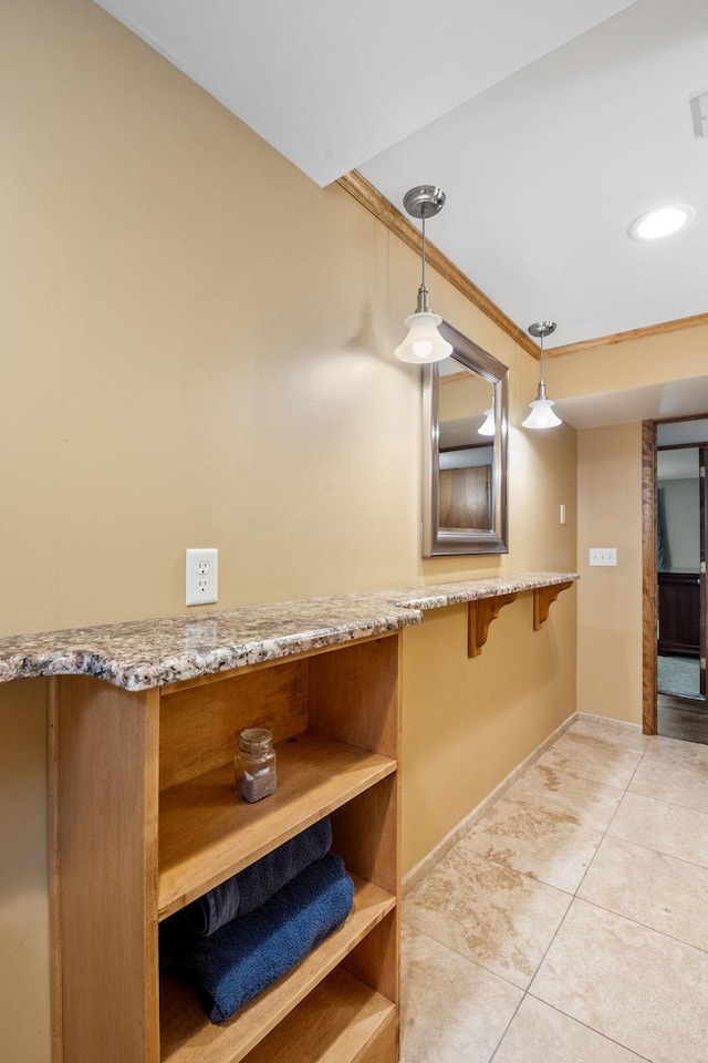 6136 Arctic Way, Edina, MN 55436 - kitchen with open shelves, light tile patterned floors, decorative light fixtures, light stone countertops, and crown molding