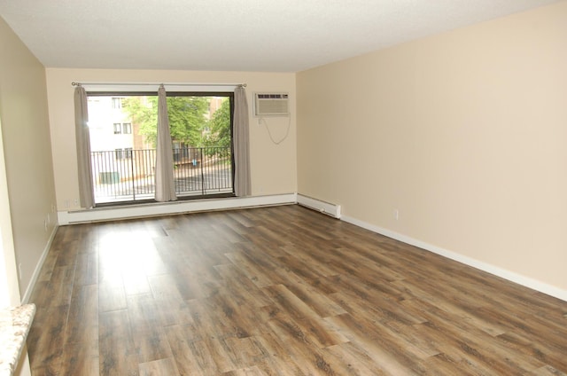 1903 Silver Bell Rd Unit 219, Eagan, MN 55122 - empty room with dark wood finished floors, a wall mounted air conditioner, a baseboard heating unit, and baseboards