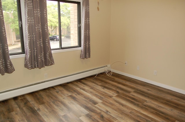1903 Silver Bell Rd Unit 219, Eagan, MN 55122 - unfurnished room with baseboard heating, wood finished floors, and baseboards