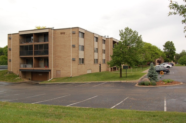 1903 Silver Bell Rd Unit 219, Eagan, MN 55122 - view of apartment building / complex featuring uncovered parking