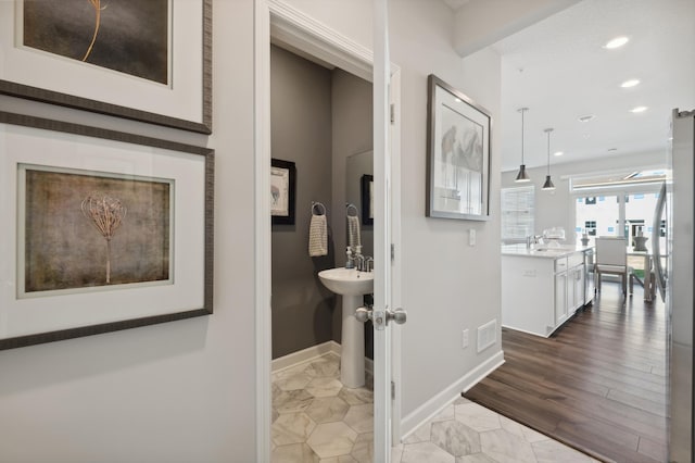 6272 205th St N, Forest Lake, MN 55025 - hall with recessed lighting, baseboards, and a sink