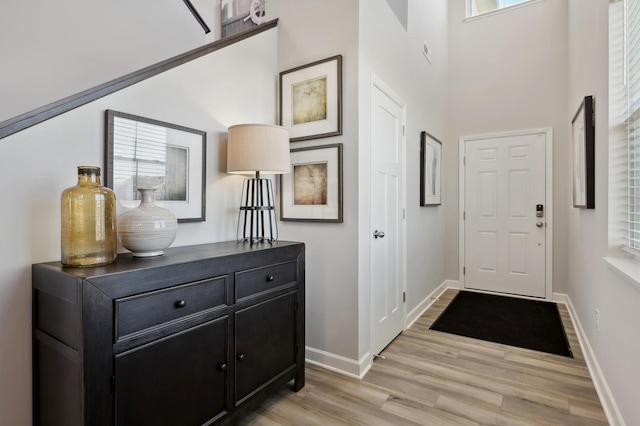 6272 205th St N, Forest Lake, MN 55025 - foyer entrance featuring light wood-style flooring, baseboards, and a towering ceiling