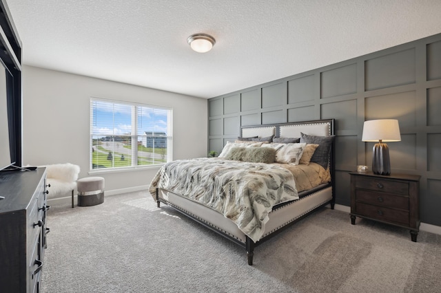 6272 205th St N, Forest Lake, MN 55025 - bedroom with carpet flooring, a decorative wall, baseboards, and a textured ceiling