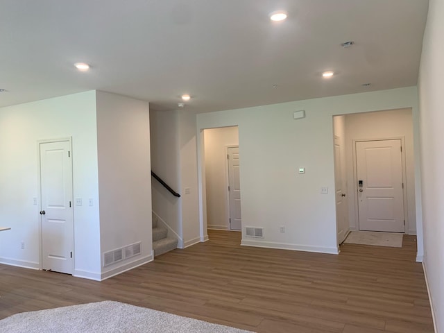 6272 205th St N, Forest Lake, MN 55025 - spare room with wood finished floors, stairway, and recessed lighting