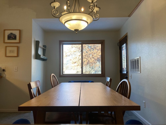 1496 Willard Lake Rd NW, Powers Twp, MN 56435 - dining room with baseboards and a chandelier