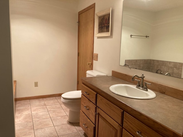 1496 Willard Lake Rd NW, Powers Twp, MN 56435 - bathroom with toilet, tile patterned flooring, vanity, and baseboards